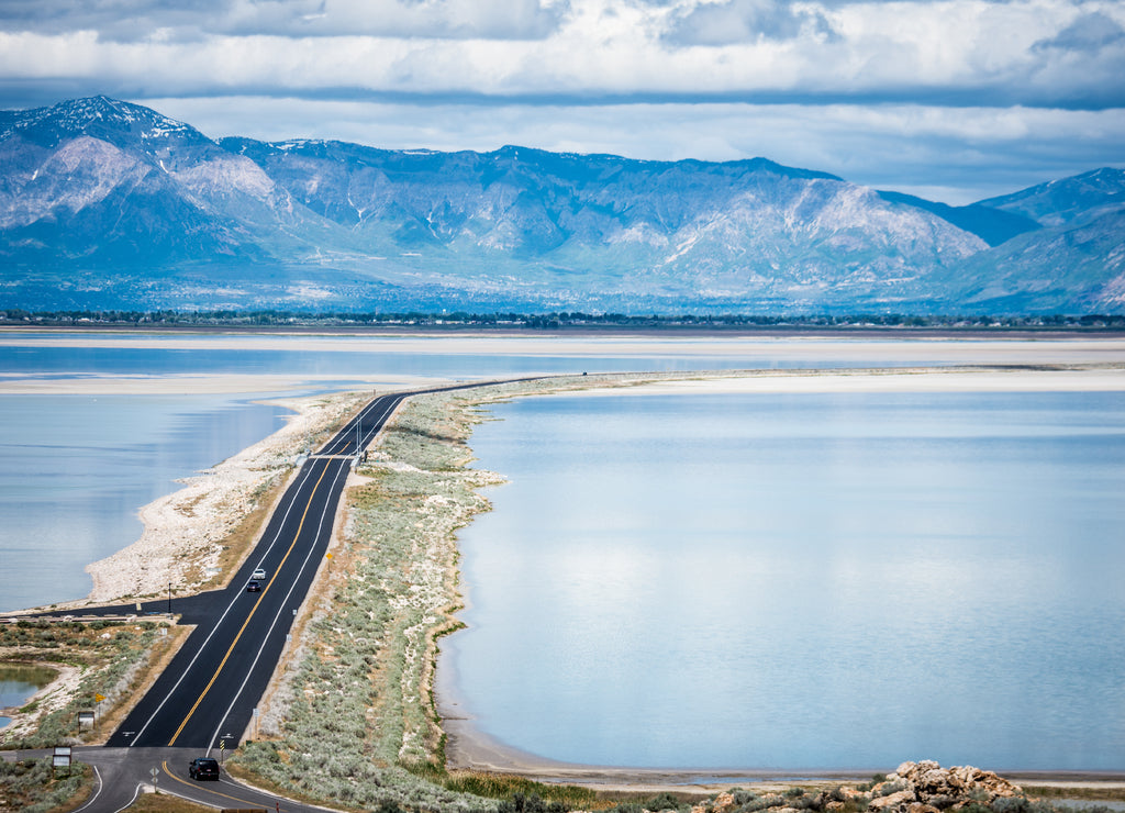 Road leading into Antelope Island State Park in Utah is on a barrier island causeway, crossing the Bridger Bay in Great Salt Lake
