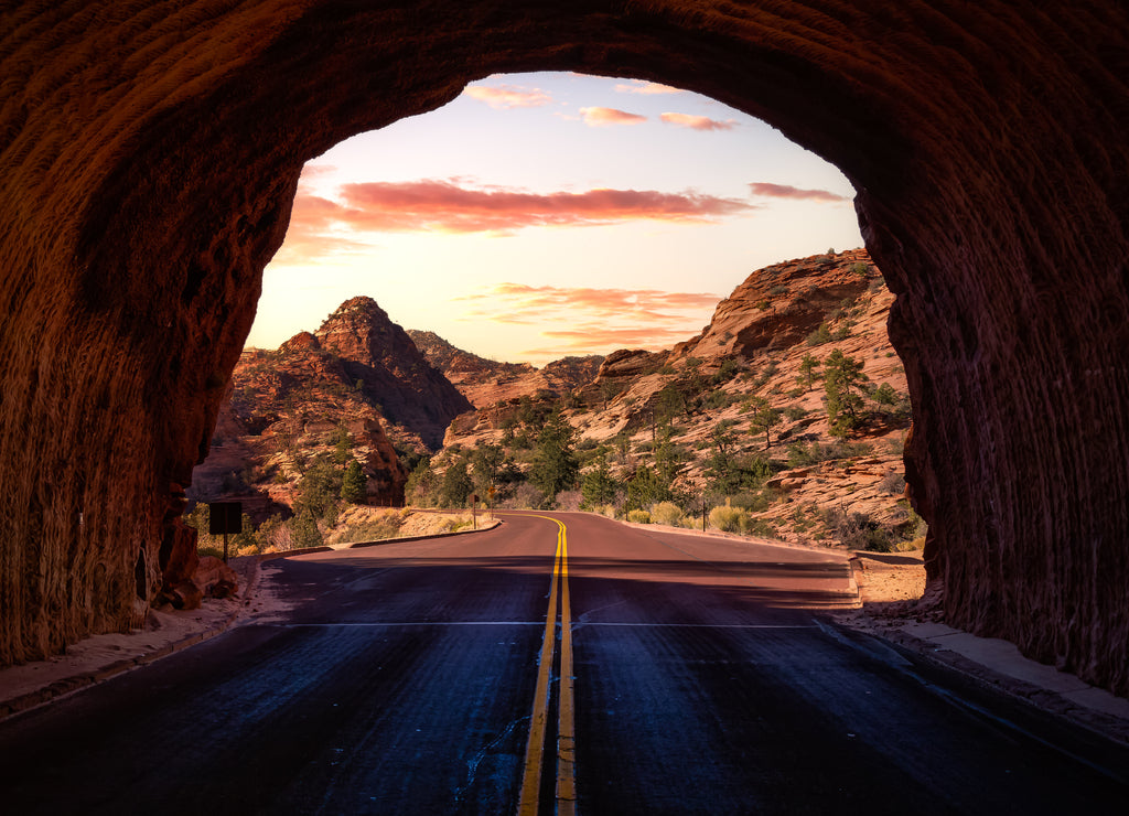 Middle of the road from tunnel view of a scenic route in American Canyons Mountain Landscape. Sunset Sky Art Render. Taken in Zion National Park, Utah, United States