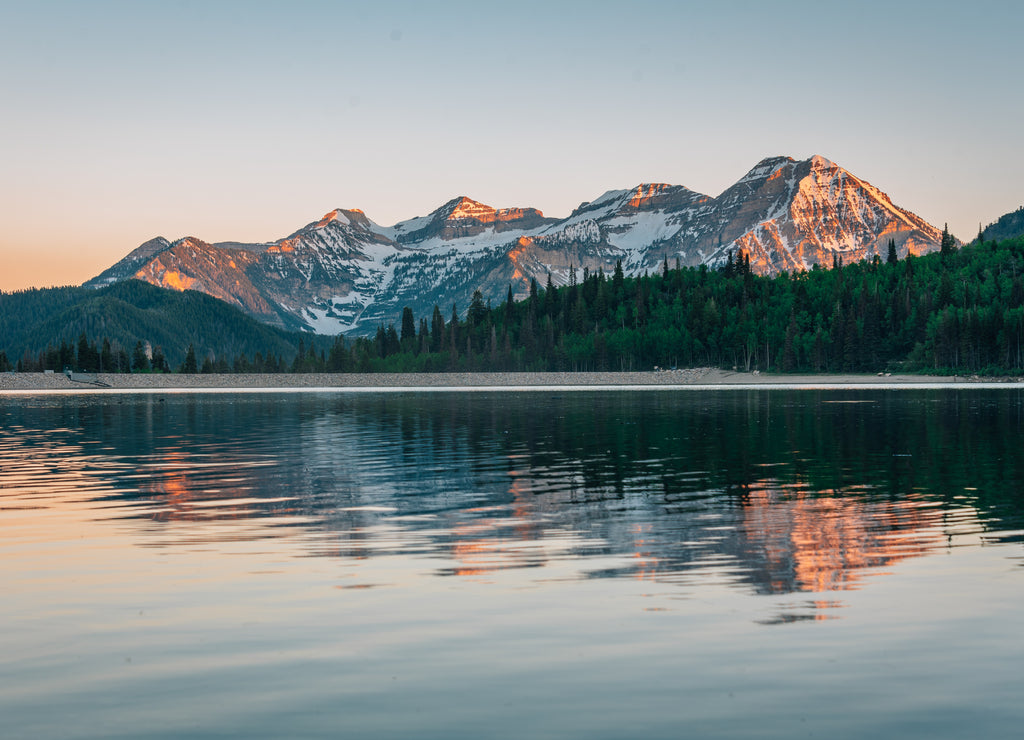 Mountains reflecting in Silver Lake Flat Reservoir at sunset, near the Alpine Loop Scenic Byway in American Fork Canyon, Uinta-Wasatch-Cache National Forest, Utah