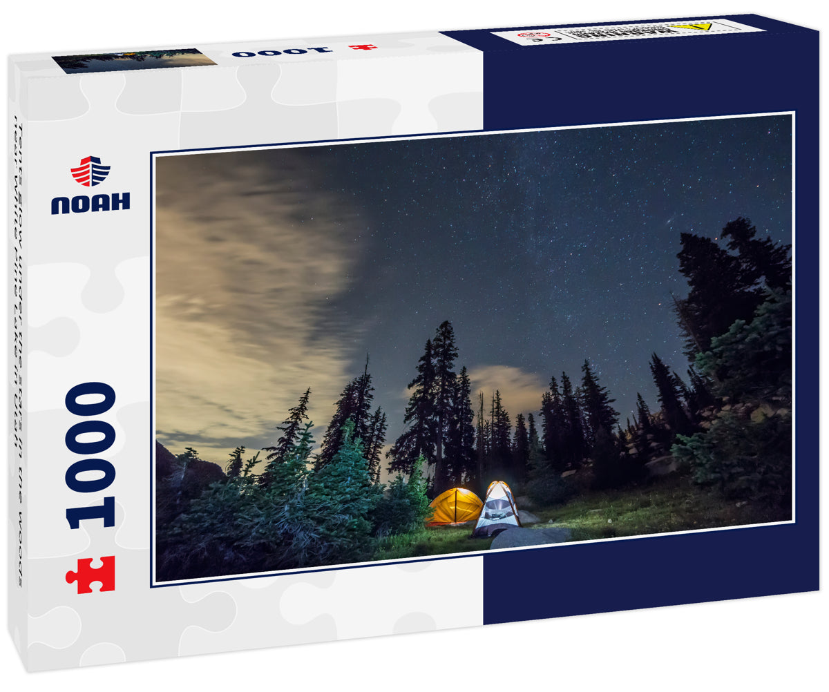 Tents glow under the stars in the woods near White Pine Lake in Utah