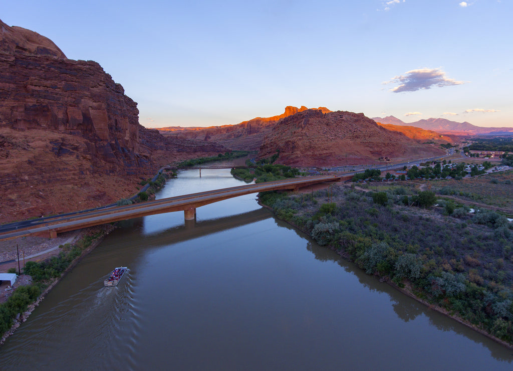 Aerial view of Colorado River and La Sal Mountains near Arches National Park at sunset in Moab, Utah, USA