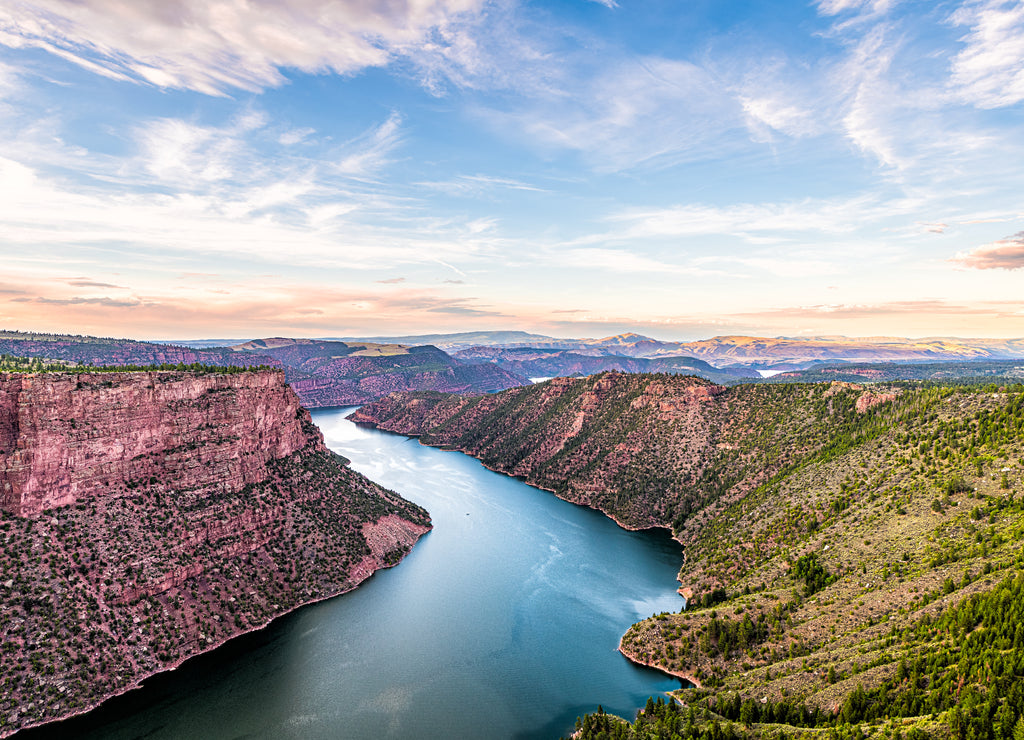 Aerial above view from Canyon Rim trail overlook near campground in Flaming Gorge Utah National Park with Green River at sunset