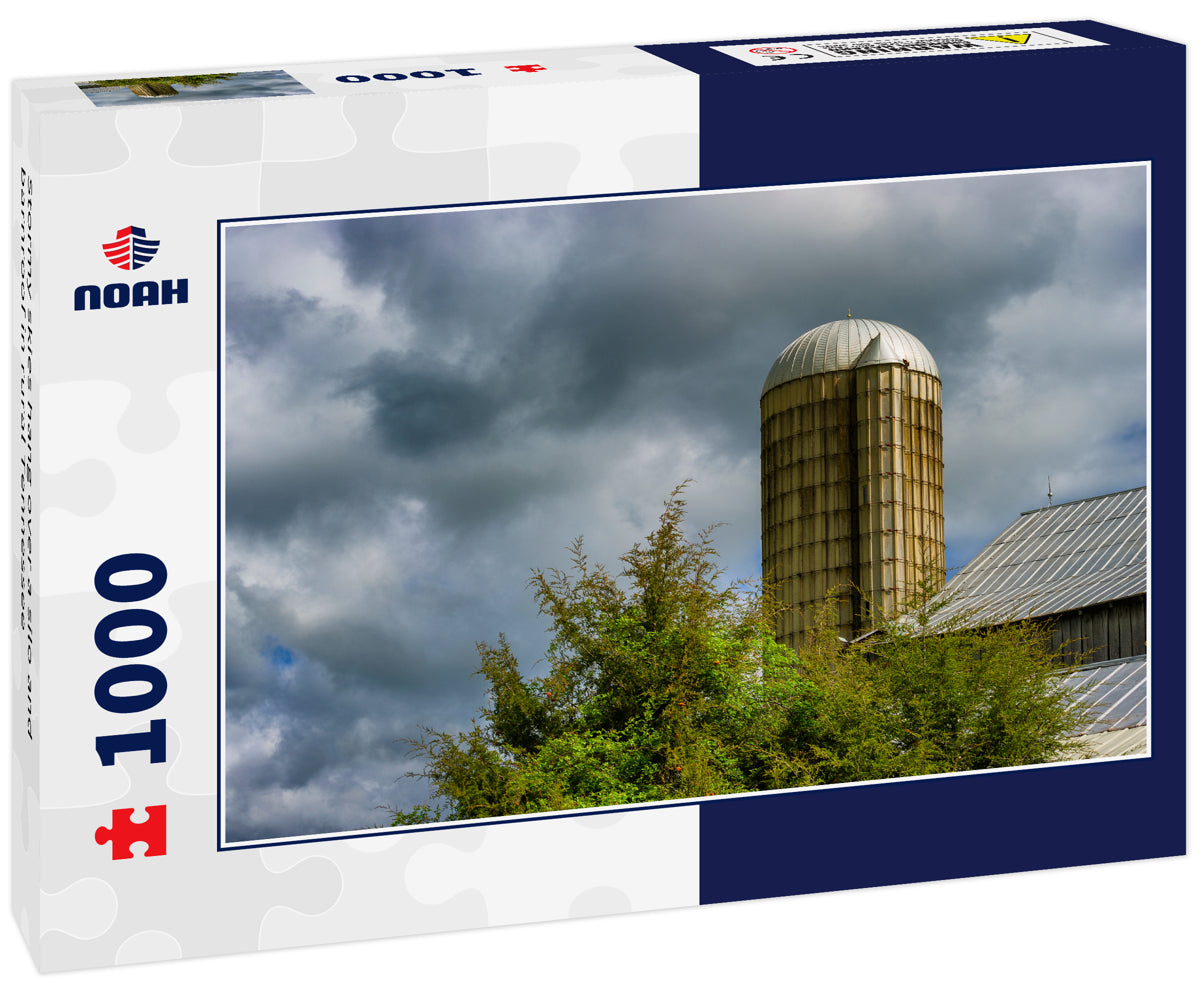 Stormy skies hang over a silo and barnroof in rural Tennessee