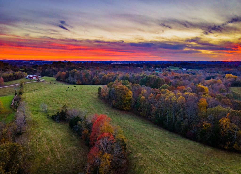 Red sky sunset over autumn forest and agricultural fields near Glasgow, Kentucky