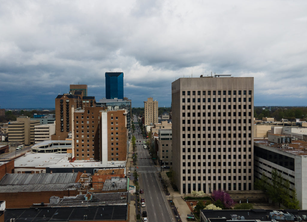 Business district in downtown Lexington, Kentucky with tall office buildings on both sides of the Main Street