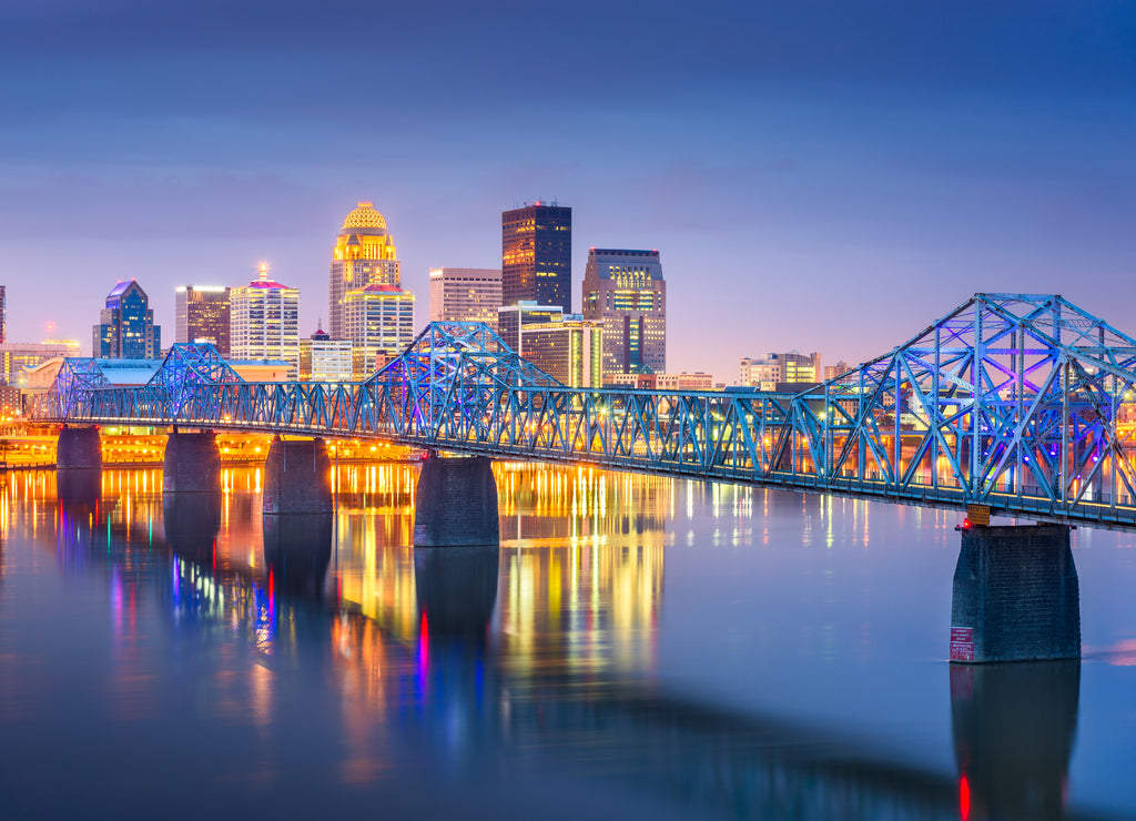 Louisville, Kentucky, USA downtown skyline on the Ohio River at dusk