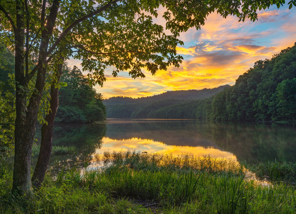 summer sunset over calm lake, appalachian mountains, kentucky