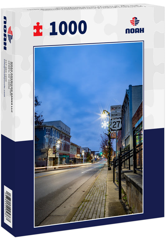 Early morning view of main street Nicholasville, Kentucky with Christmas decorations on lamp posts and sign of road 27 on the foreground