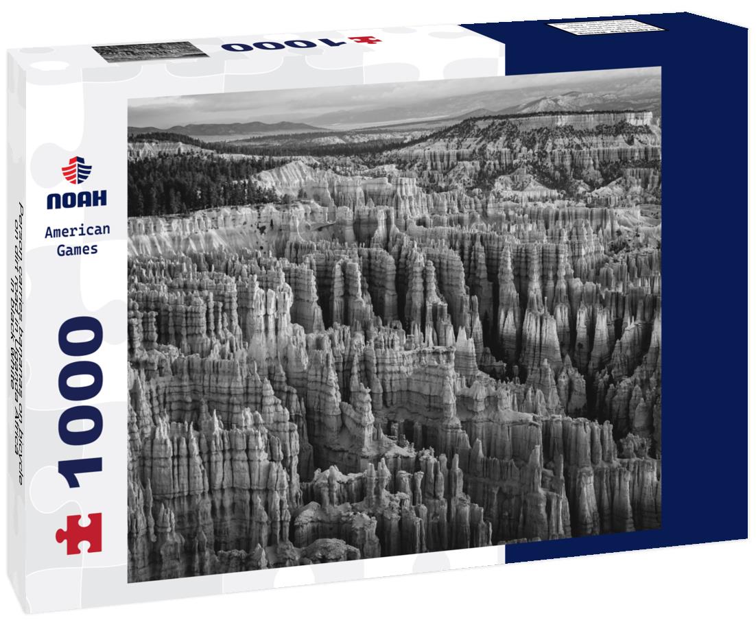 Noah Jigsaw Puzzle Person carries bananas on bicycle on dirt road in Uganda Africa in black white 1000 pieces