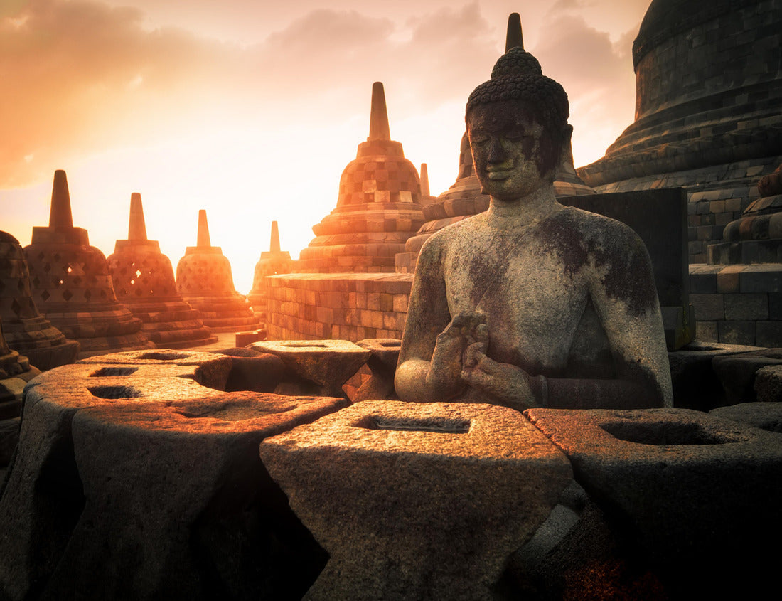 Noah Jigsaw Puzzle Amazing sunrise view of meditating Buddha statue and stone stupas against shining sun on background. Ancient Borobudur Buddhist temple. Great religious architecture. Magelang, Central Java, Indonesia 1000 pieces
