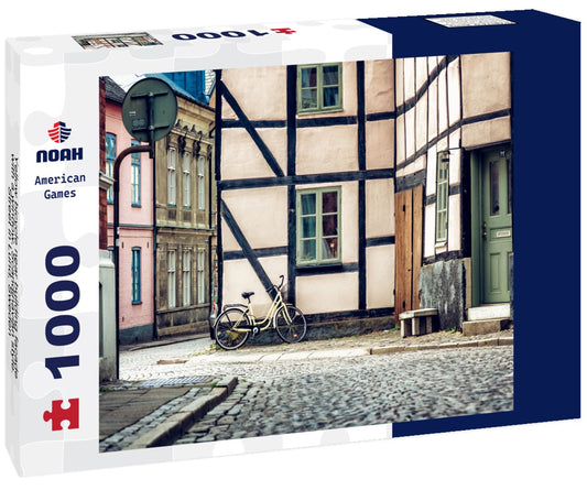 Noah Jigsaw Puzzle Yellow bicycle near building facade with a window, Scandinavian style. Street in Lund, Sweden 1000 pieces