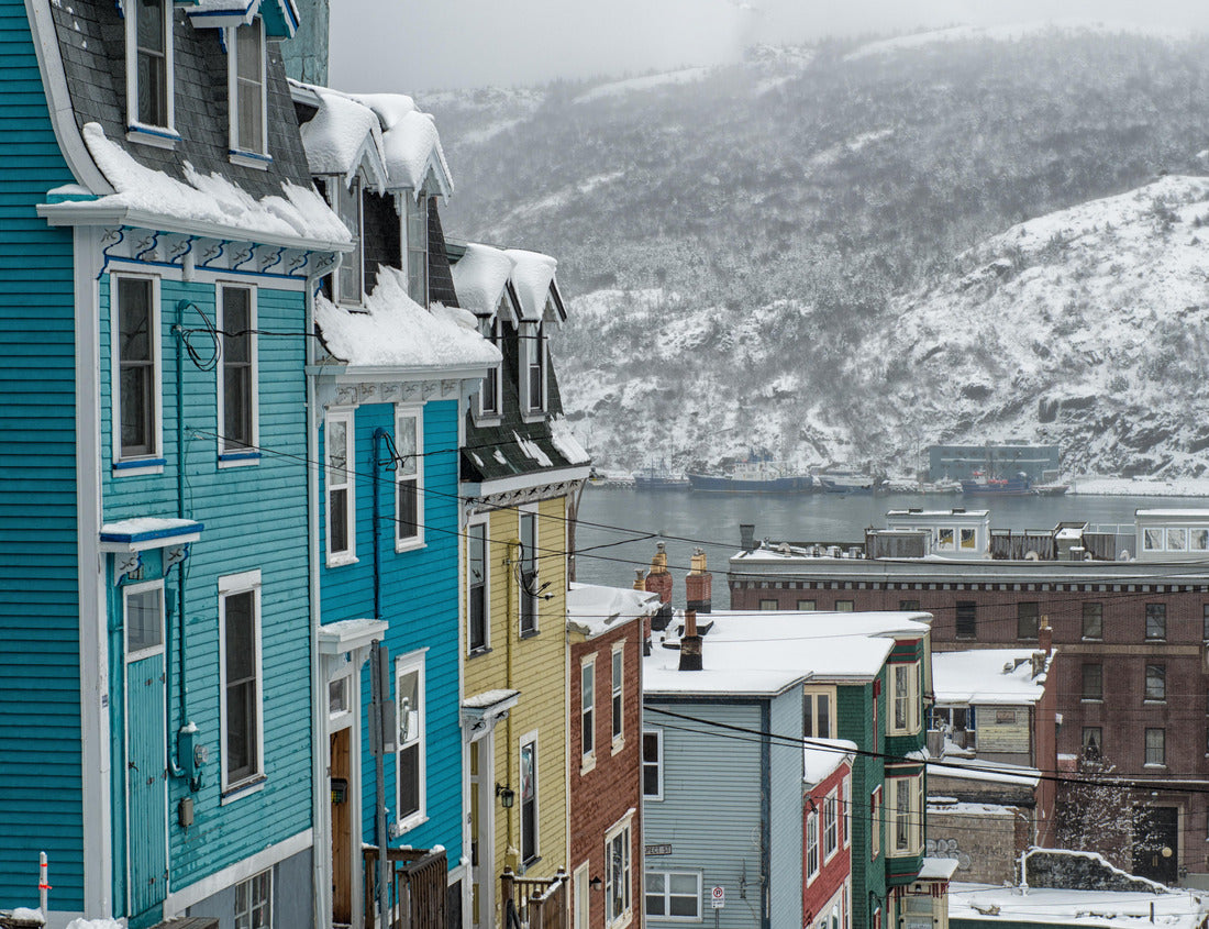 Noah Jigsaw Puzzle A very steep street in St. John's, Newfoundland, on a foggy winter's day, with bright colored row houses descending down the road. There's snow on the hillside in the background and a smooth harbor 1000 pieces