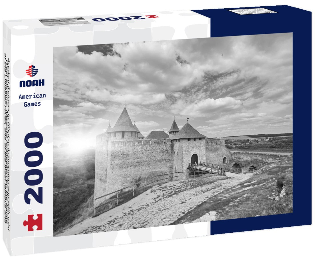 Noah Jigsaw Puzzle Ancient fortress in Khotyn in morning sun with mist, West Ukraine. Majestic fortification on the banks of the Dniester River, one of the most famous and largest castles in Ukraine in black white 2000 pieces