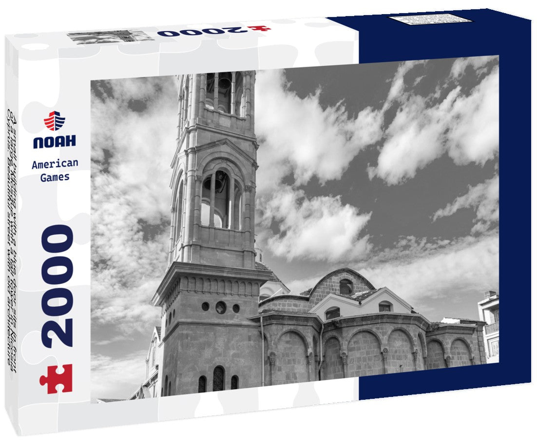 Noah Jigsaw Puzzle A small building with a blue door sits in front of a large Mosque with a tall tower in Nicosia, Cyprus. Beautiful street with old architecture in Nicosia, Cyprus in black white 2000 pieces