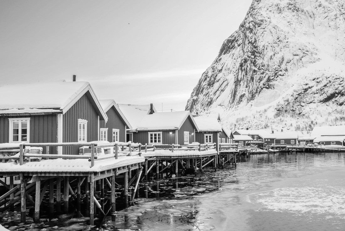 Reine village with traditional rorbu houses on Lofoten islands in winter. Scandinavian landscape with red wooden fishermen cabins on frozen sea water and snowy Reinebringen mountain, northern Norway 2000pc PuzzleBlack and White