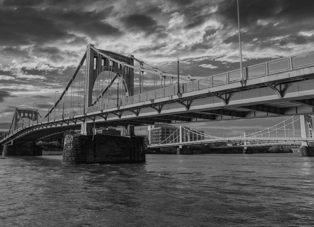 Sunset view of downtown bridges and the Allegheny River in Pittsburgh, Pennsylvania in black white