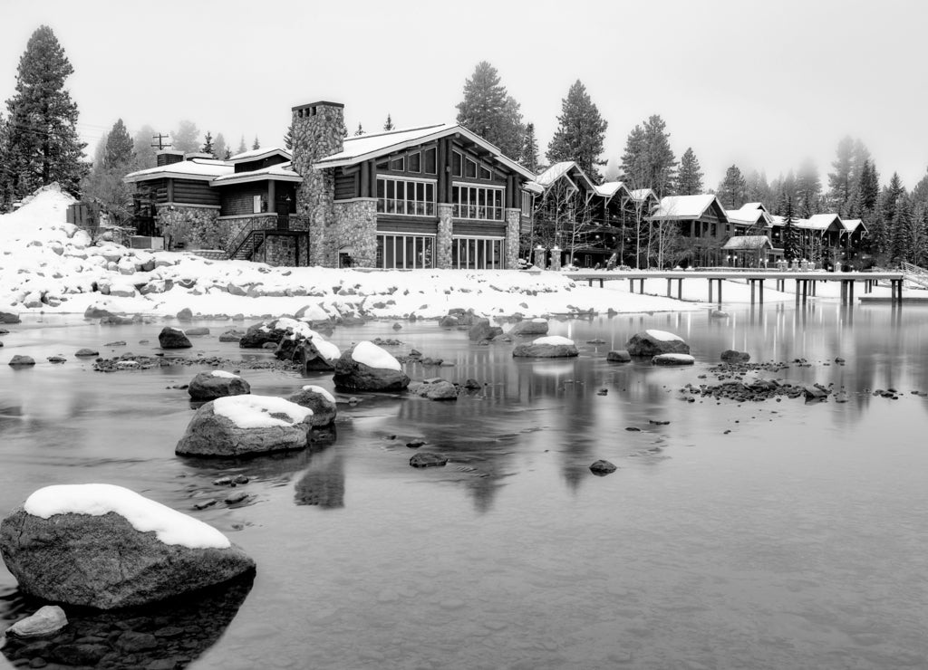 Hotel on the edge of an Idaho mountain lake in winter in black white