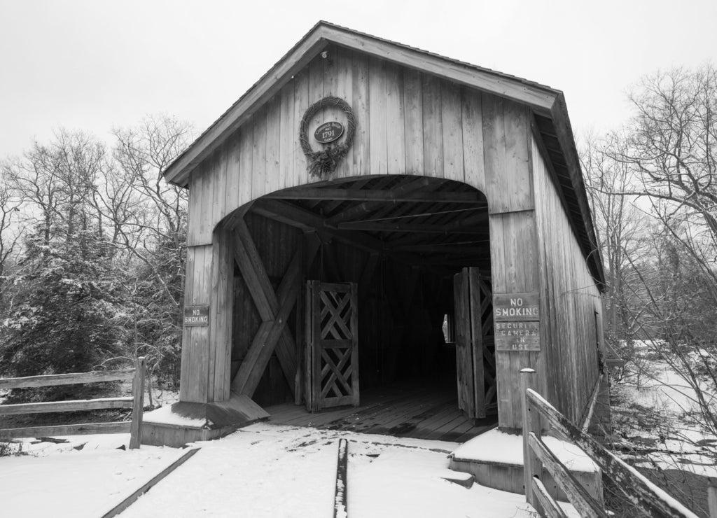 Comstock Covered Bridge over the Salmon River in Colchester, Connecticut in black white