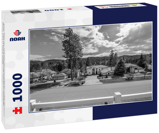 View from the balcony of a luxury home of the Spokane River, mountains and upscale homes in Post Falls, Idaho, USA in black white