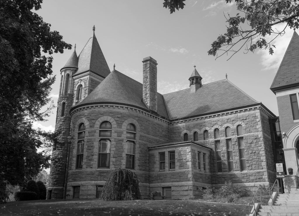 Laconia Public Library at 695 N Main Street in city center of Laconia, New Hampshire, USA in black white