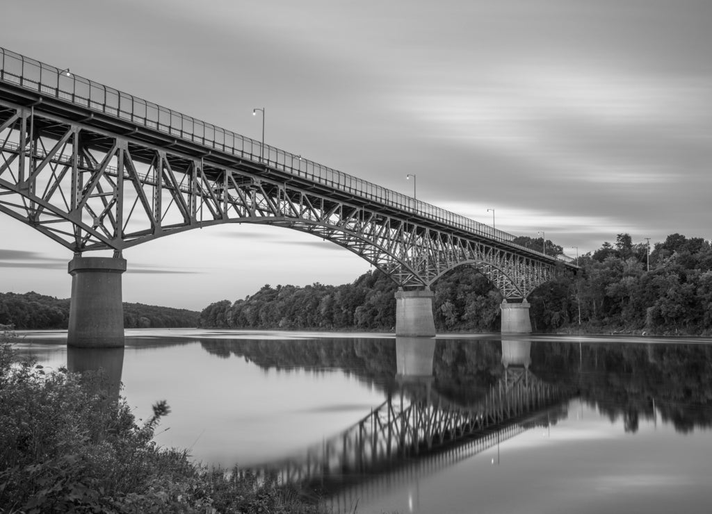 Augusta, Maine, USA view on the Kennebec River with Memorial Bridge in black white