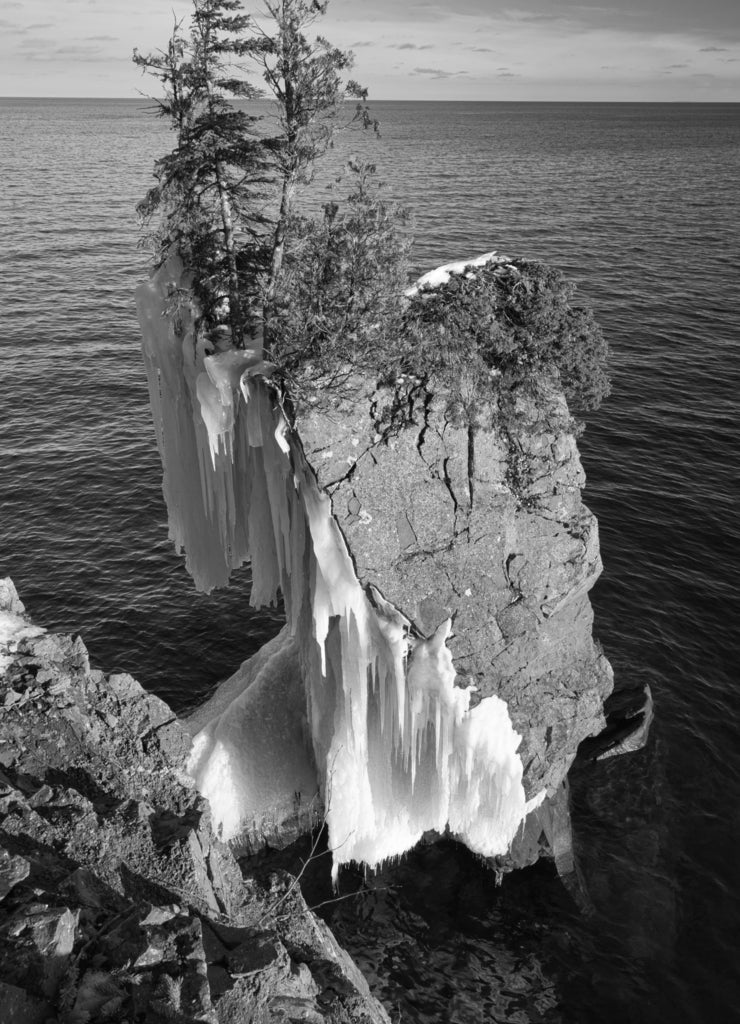 Cliff at Tettegouche State Park half-covered with ice, Lake Superior, Minnesota in black white