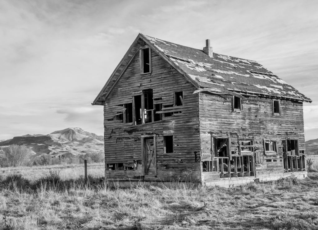 Forgotten homestead in Idaho at sunset in black white