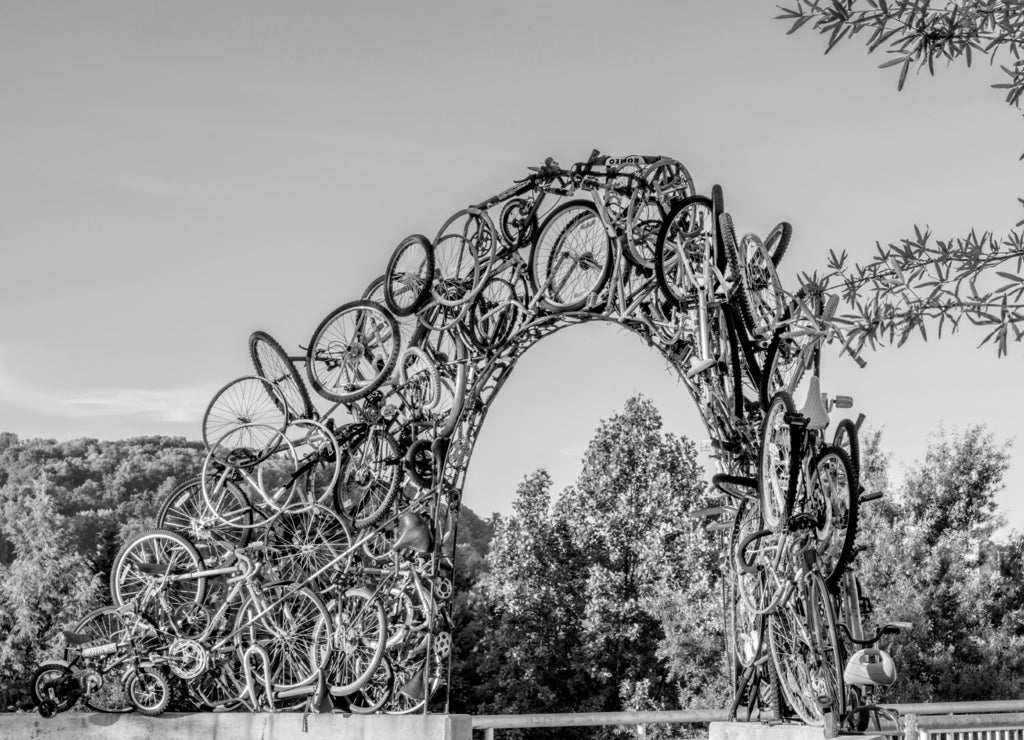 Unique arch made of bicycles along the Tennessee River in black white