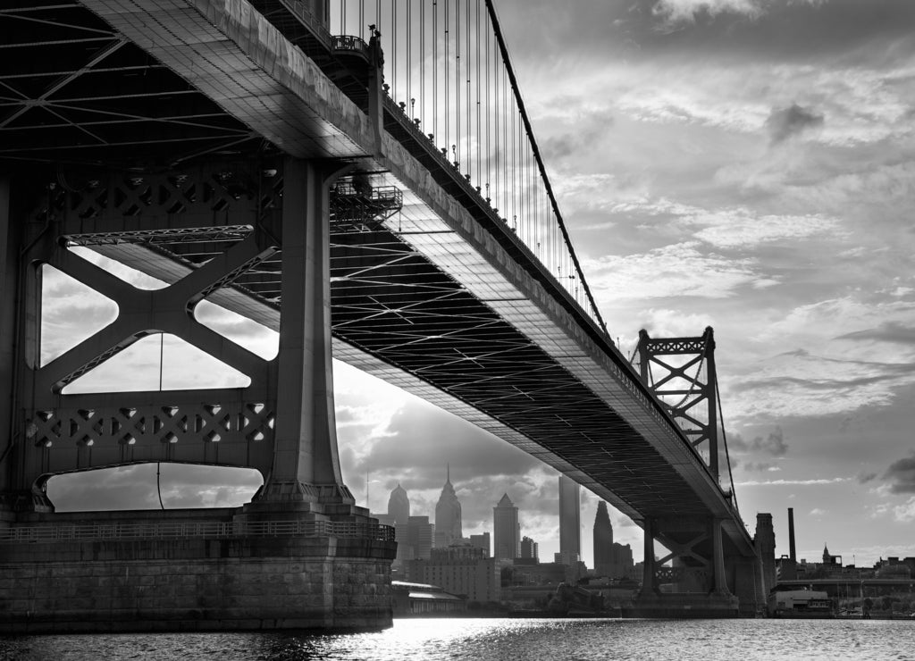 Ben Franklin Bridge above Philadelphia skyline at sunset, US in black white