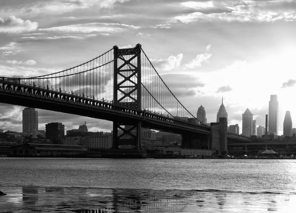 Philadelphia skyline and Ben Franklin Bridge at sunset, US in black white
