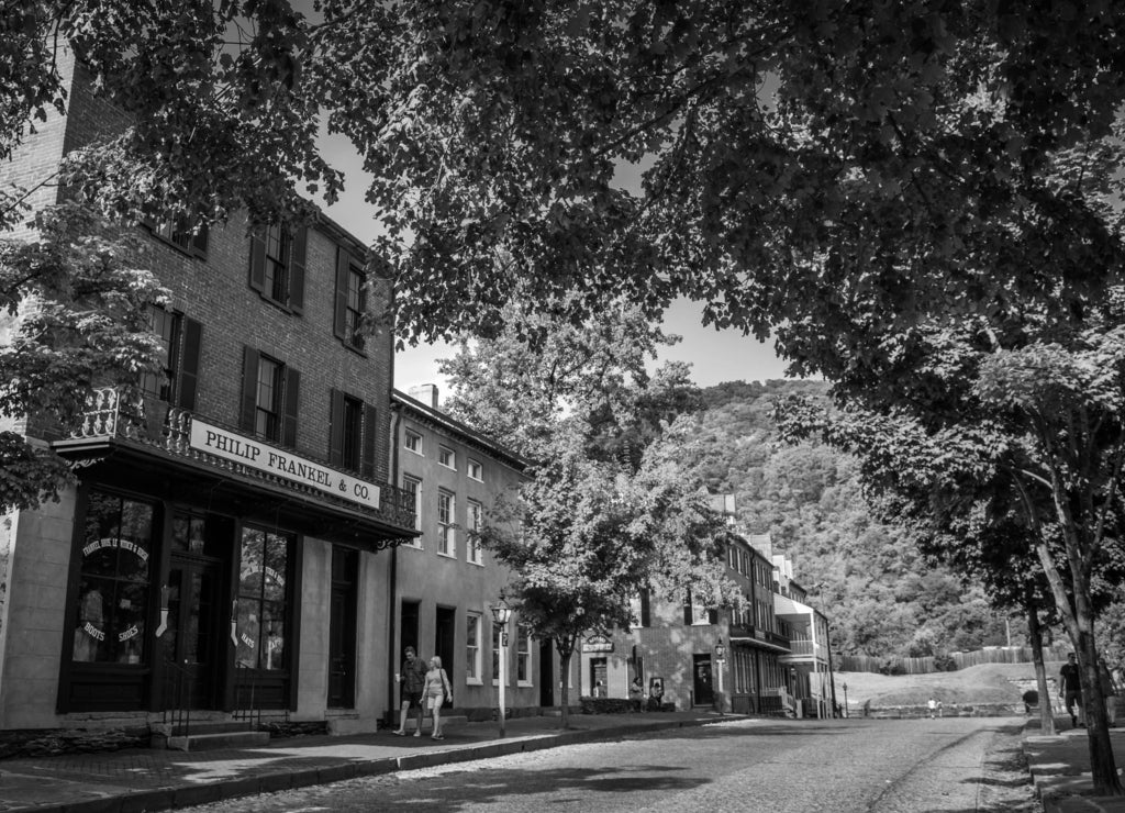 Historic buildings along Shenandoah Street in Harper's Ferry, West Virginia in black white