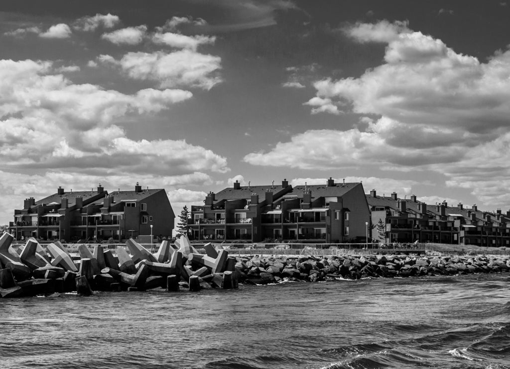 Waterfront condos and a jetty in Point Pleasant Beach, New Jersey in black white