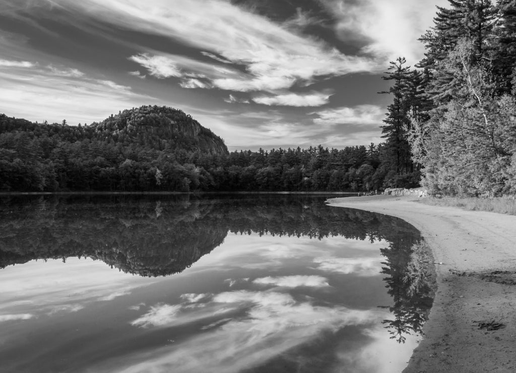 Early fall color and reflections at Echo Lake in Echo Lake State, New Hampshire in black white