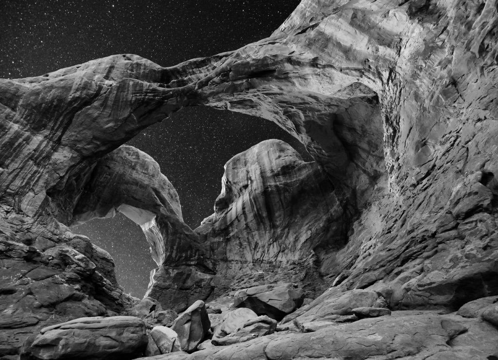 A night shot of Double Arch, Arches National Park, Utah in black white