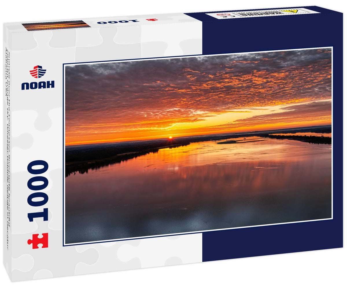 Sunrise over the Tennessee River with beautiful colorful orange sky. Wheeler Wildlife Refuge in Decatur Alabama USA