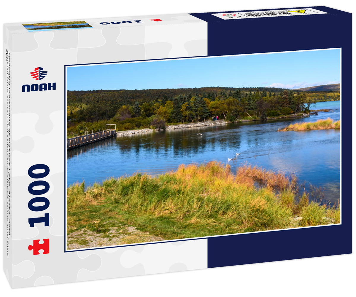 Peaceful landscape at Naknek Lake, Alaska, with glacial blue water, fall color, and cloudy white and blue sky