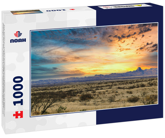 The Sonoran Desert grassland of Buenos Aires National Wildlife Refuge, Arizona, USA. Vivid sunset over the Baboquivari Mountains and the iconic Baboquvari Peak