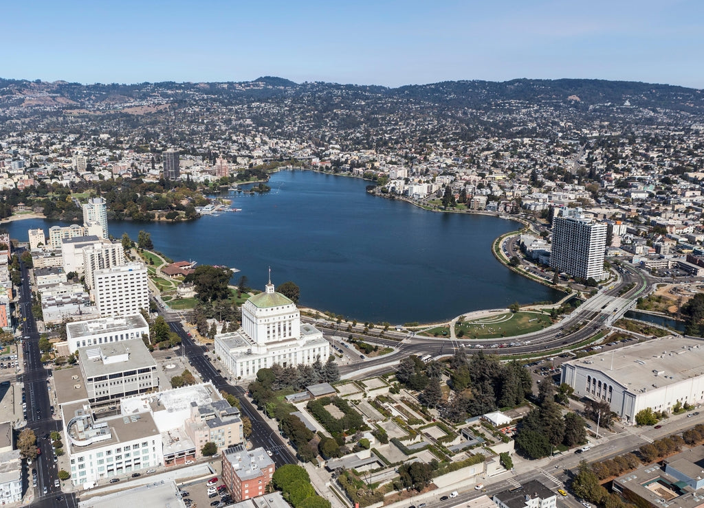 Aerial view of Lake Merritt Park and downtown buildings and streets in Oakland California
