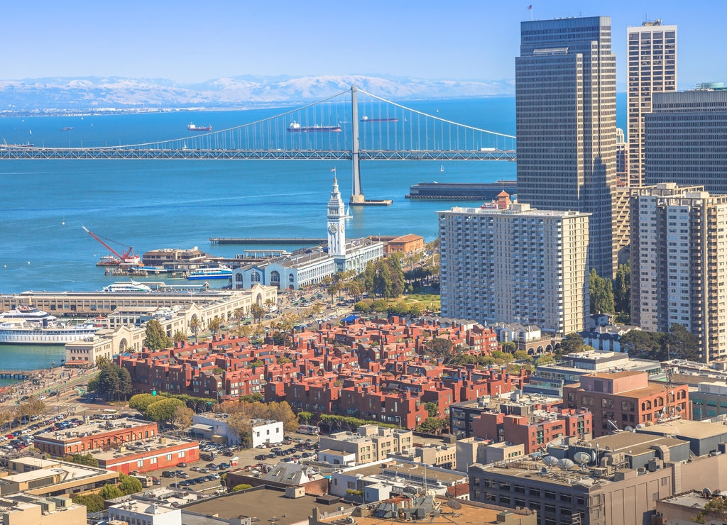 Aerial view close up of San Francisco skycraper, Embarcadero and Oakland Bridge from top of Coit Tower on Telegraph Hill on a sunny day
