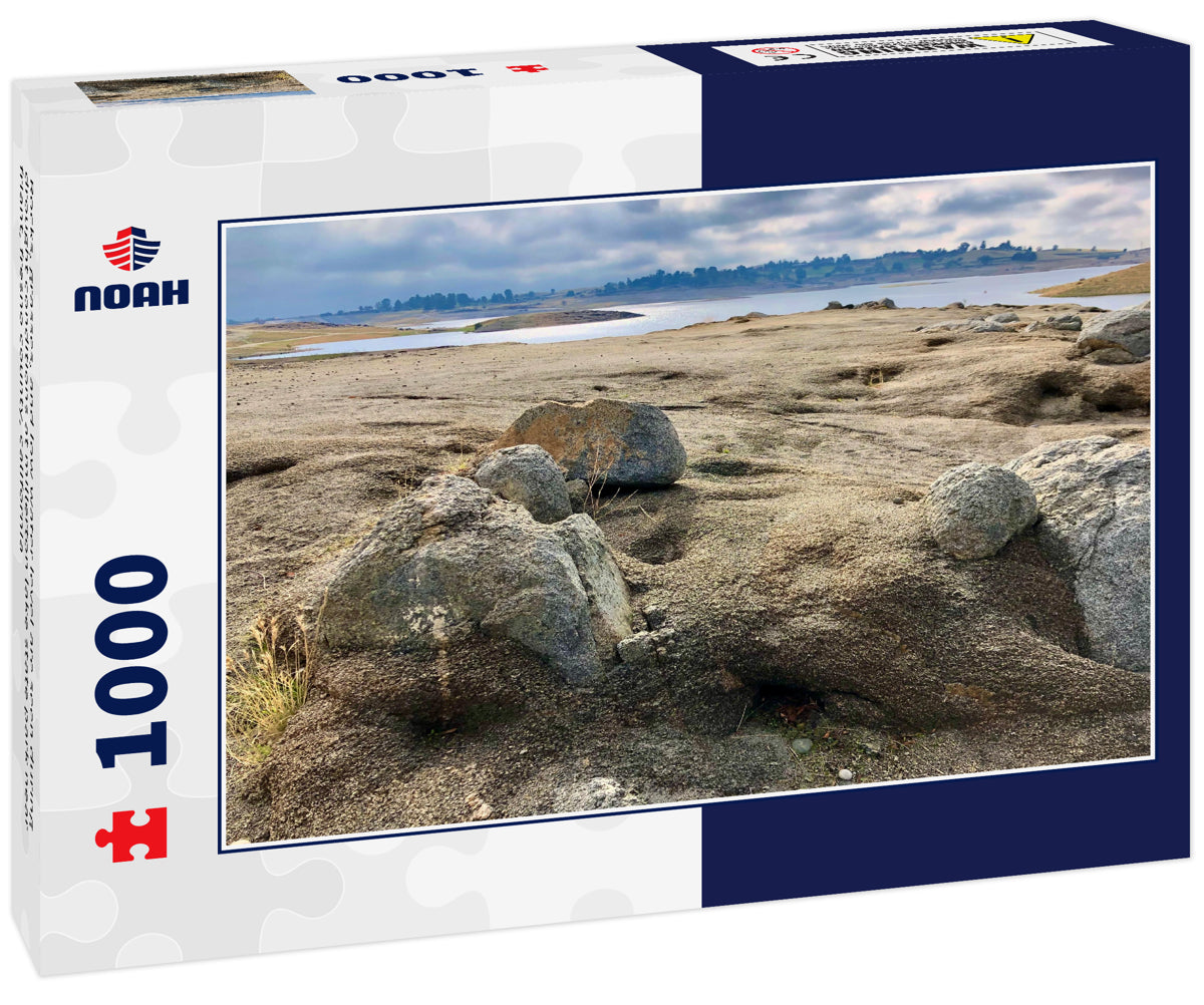 Rocks, grasses, and low water level are seen during drought conditions at millerton lake state park near friant, fresno county, california