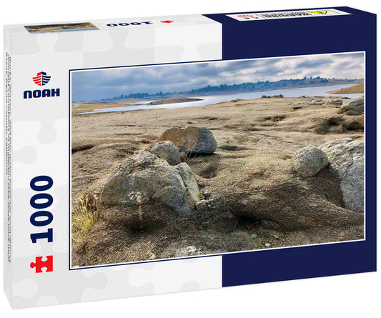Rocks, grasses, and low water level are seen during drought conditions at millerton lake state park near friant, fresno county, california