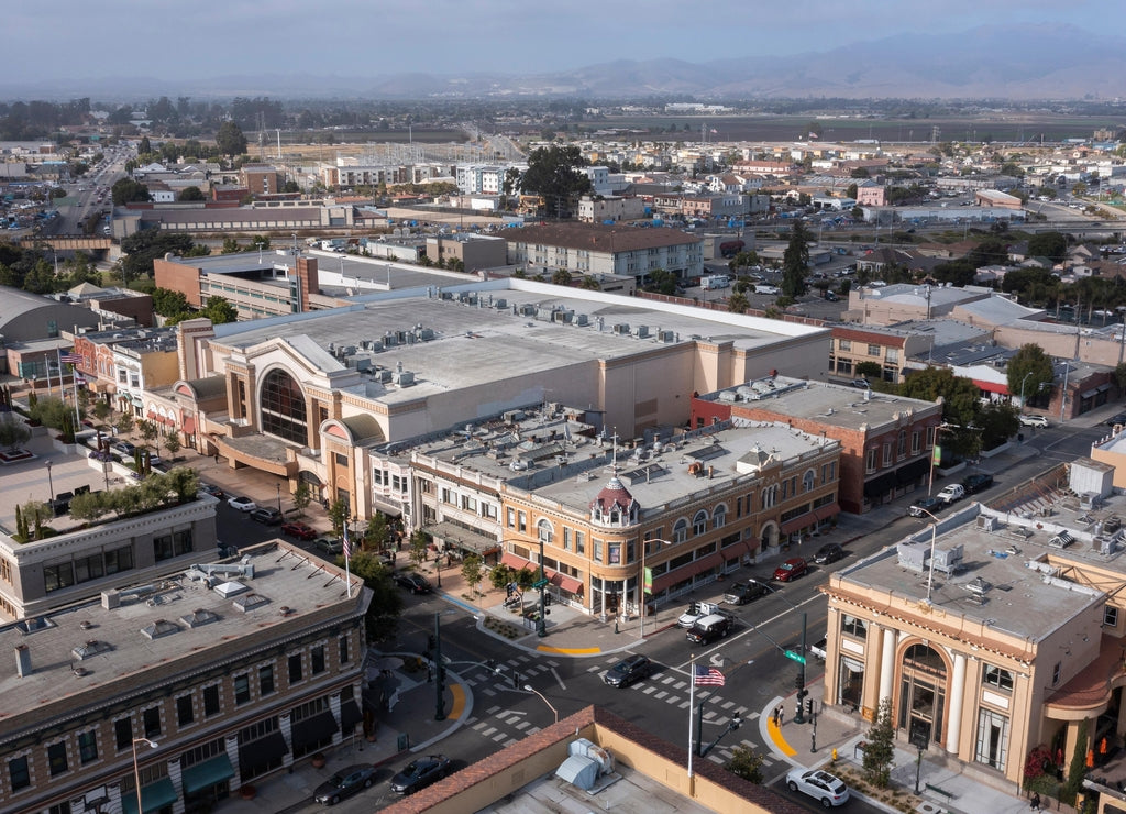 During a break in the fog, afternoon sunlight shines on the historic city center of downtown Salinas, California, USA