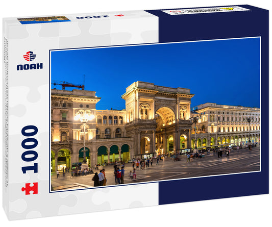 People walking near Vittorio Emanuele II gallery at Duomo square, Milan, Italy. Night view of street and buildings