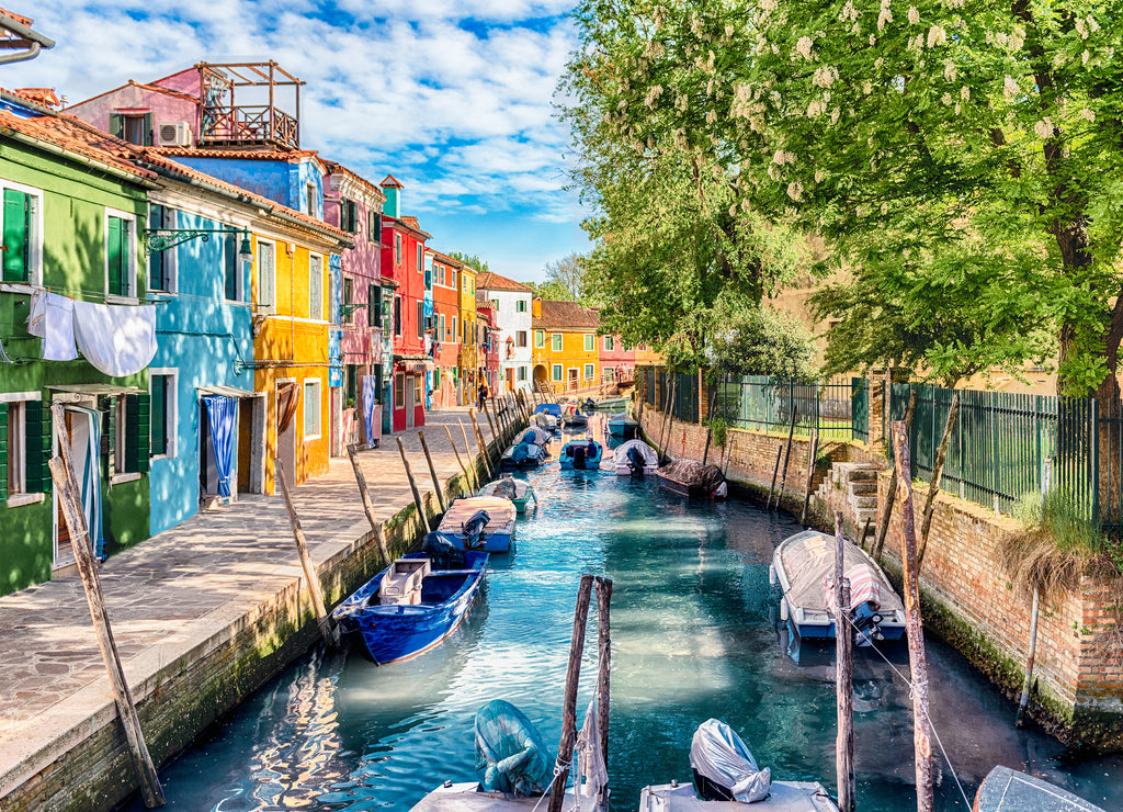 Colorful houses along the canal, island of Burano, Venice, Italy