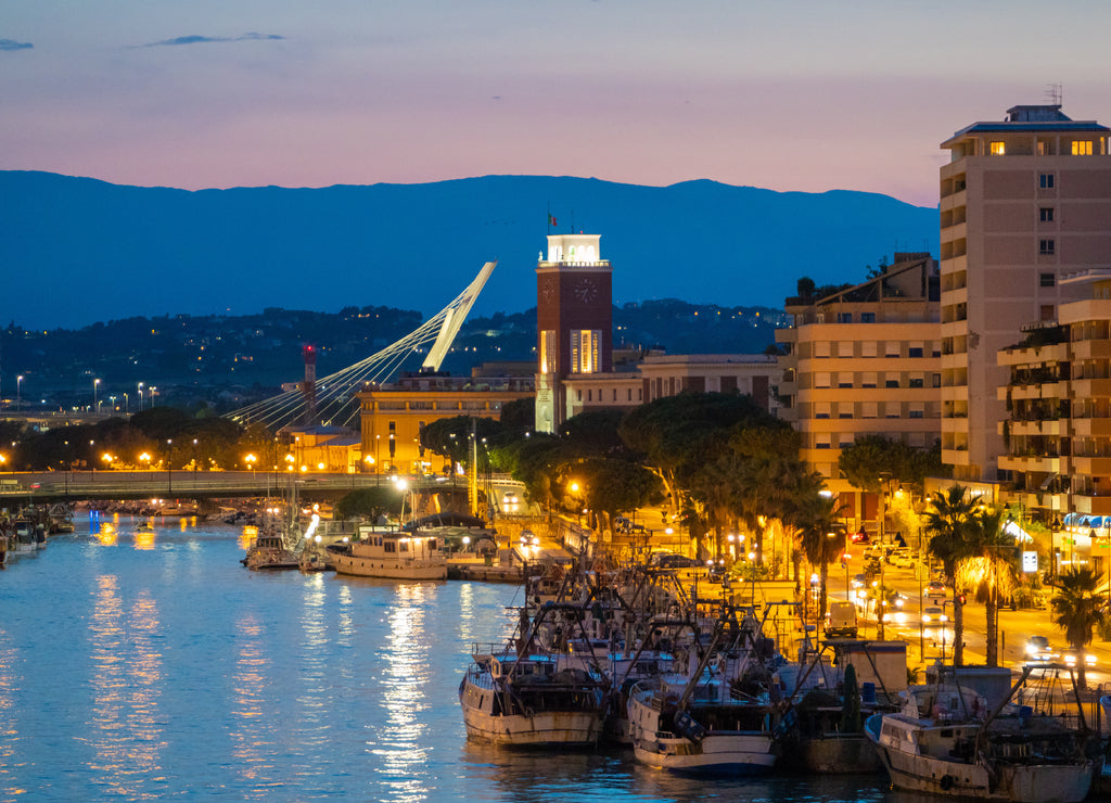 Pescara (Italy) - The view in the dusk from Ponte del Mare monumental bridge in the canal and port of Pescara city, Abruzzo region
