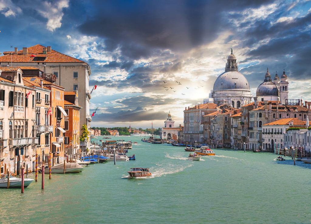 Old cathedral of Santa Maria della Salute in Venice, Italy at sunset