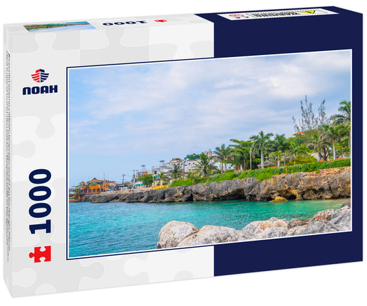 Beautiful coastal cliffside turquoise ocean on Caribbean island. Sunny summer vacation day on the coast of Montego Bay, Jamaica. Ideal tropical tourist destination. Margaritaville in background