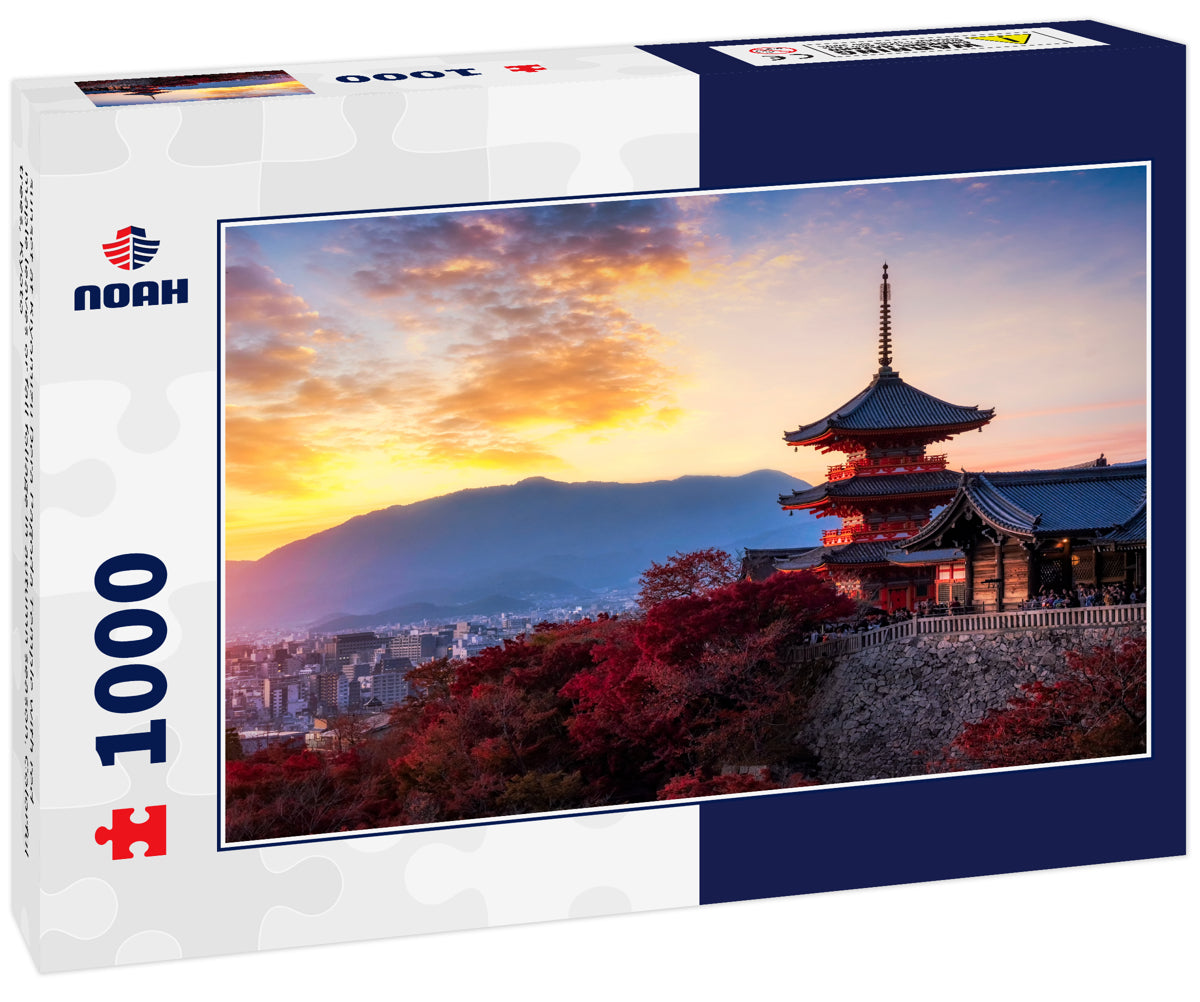 sunset at Kiyomizu Dera Pagoda Temple with red maple leaves or fall foliage in autumn season. Colorful trees, Kyoto