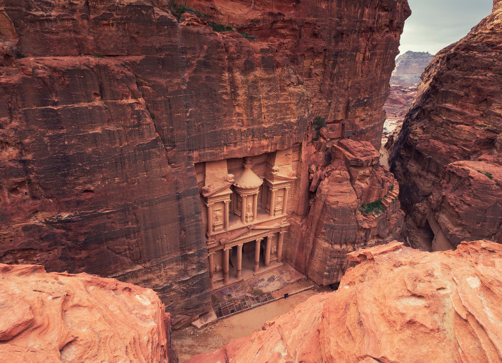 Top view of Al Khazneh - rock cut temple, the treasury in ancient Nabatean city of Petra, Jordan