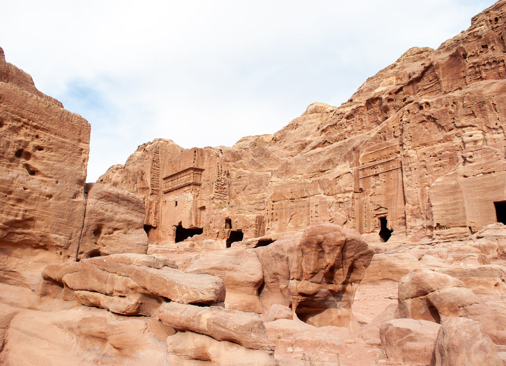 The ancient city of Petra in Jordan became one of the 7 New Wonders of the World. The city's carved rose-red sandstone rock facades, tombs, and temples